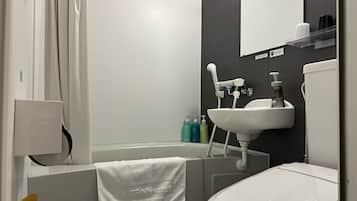 Combined shower/tub, free toiletries, hair dryer, slippers