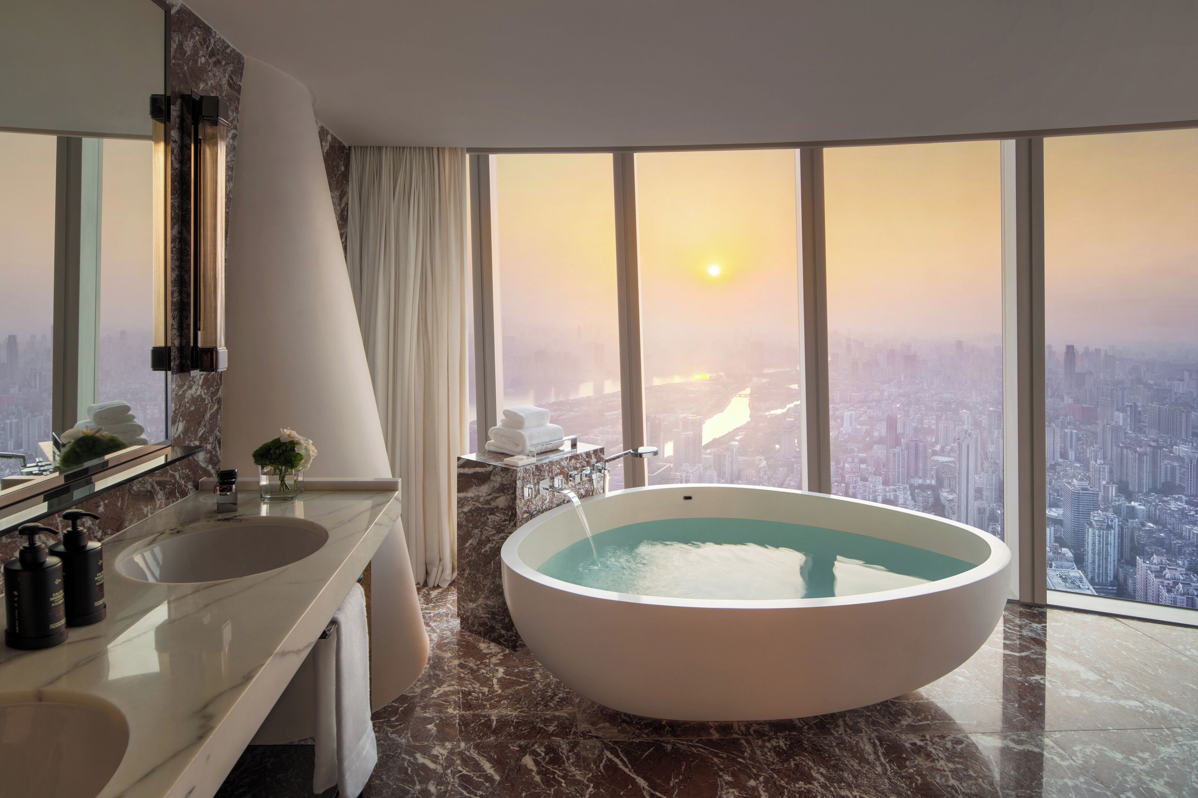 Premier King Room with River View | Bathroom | Combined shower/tub, rainfall showerhead, designer toiletries
