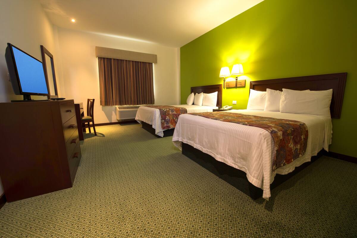 Desk, blackout drapes, iron/ironing board, bed sheets
