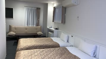 Triple Room, Non Smoking (25 sqm, No Elevator Access) | Desk, blackout drapes, soundproofing, iron/ironing board