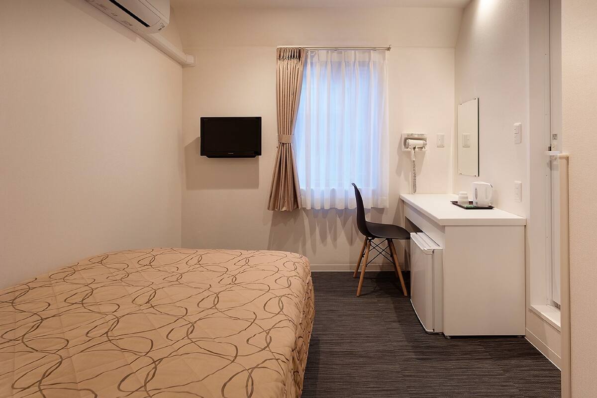 Desk, blackout curtains, soundproofing, iron/ironing board (on request)