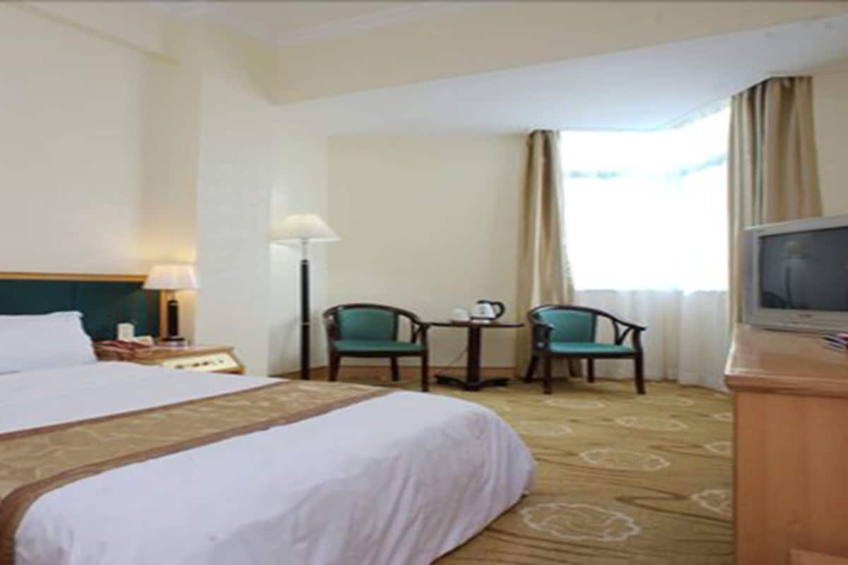 Colchones con pillow-top, minibar, escritorio y cortinas blackout