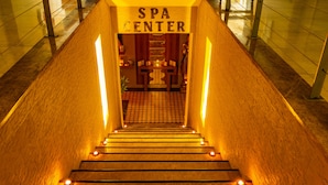 A staircase leading to a spa center with a sign above. - Ambassador Plaza (Kemer)