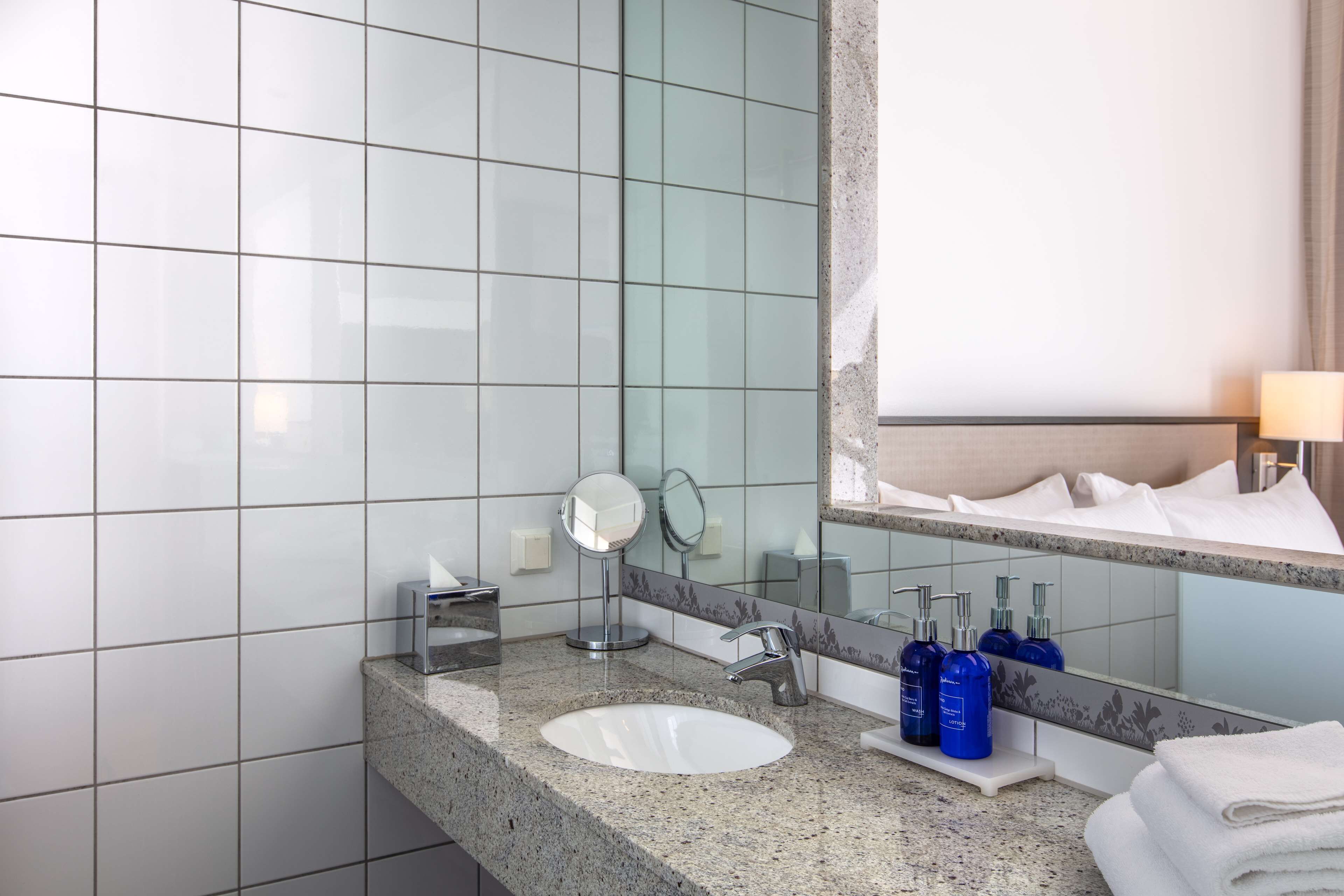 standard room, balcony, city view | bathroom | shower, eco-friendly toiletries, hair dryer, towels