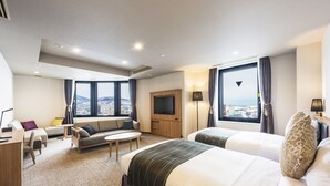 A hotel room with two beds, a sofa, a TV, and a desk. - Hotel Nord Otaru (Otaru)
