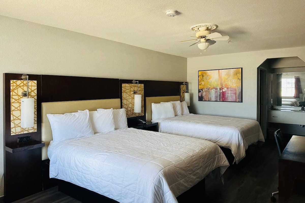 Deluxe Room, 2 Queen Beds, Non Smoking | Pillow-top beds, desk, iron/ironing board, free WiFi
