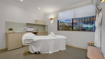 Enjoy a peaceful retreat with a single bed, desk, and window offering a view of lush greenery.