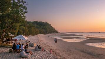 On the beach, sun-loungers, beach umbrellas, beach towels