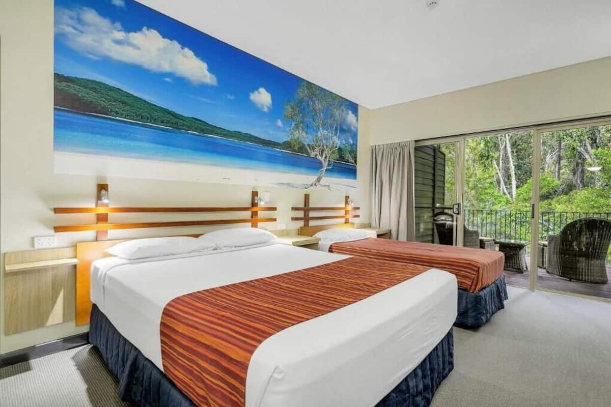 Wallum Family Resort Room | Laptop workspace, iron/ironing board, bed sheets