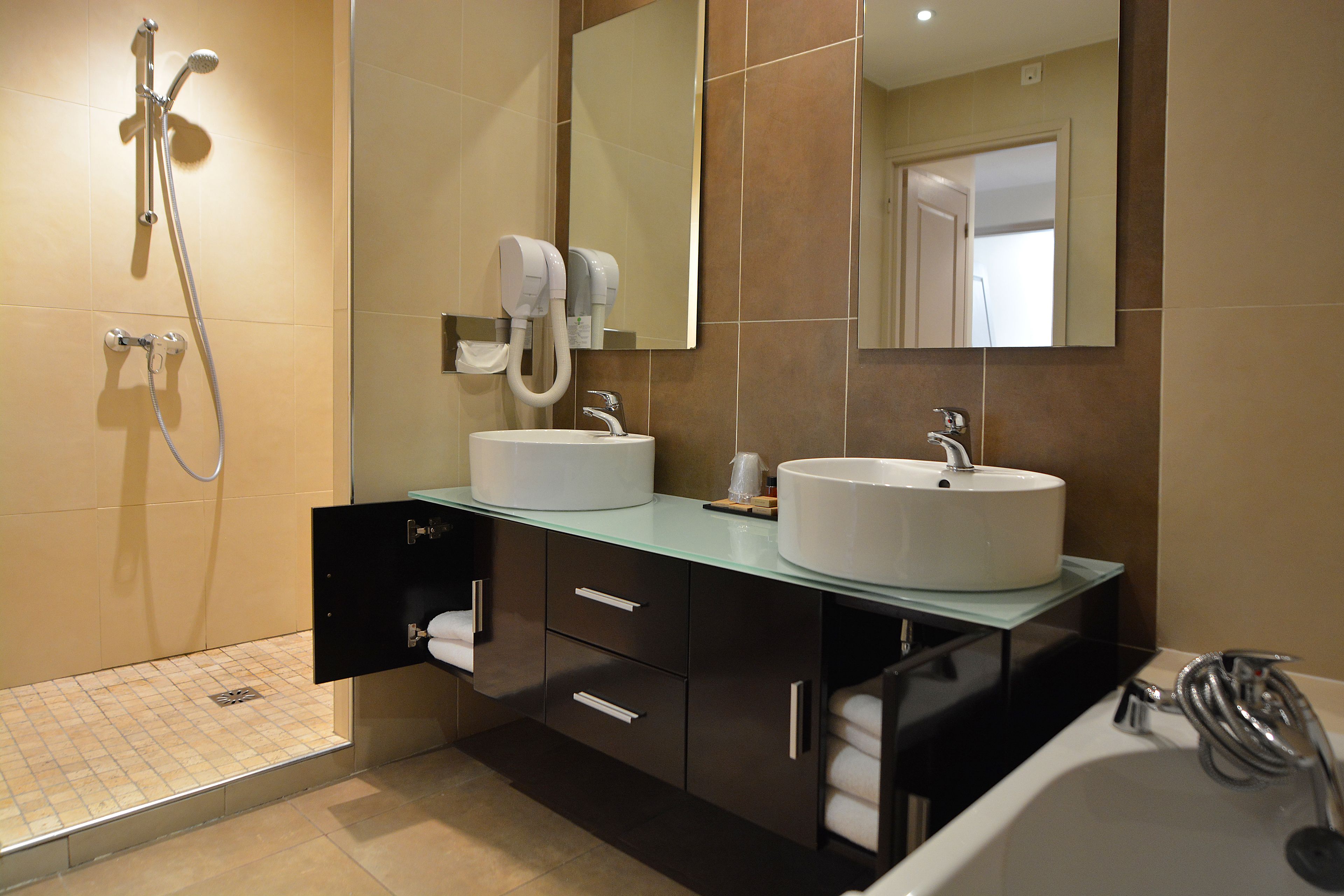 deluxe junior family room | bathroom | free toiletries, hair dryer, towels