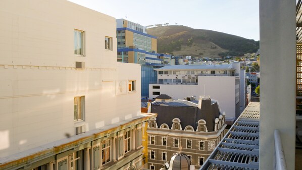 A view of a cityscape with various buildings, including a mix of modern and historic architecture.