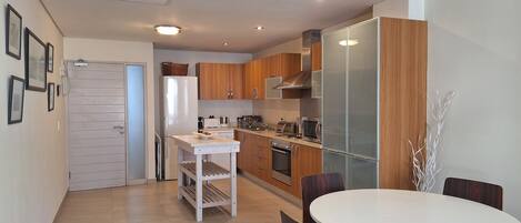 At Greenmarket Place | Living area | 32-inch LED TV with satellite channels, TV, DVD player