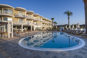 Outdoor pool, open 10:30 AM to 7:30 PM, pool umbrellas, pool loungers