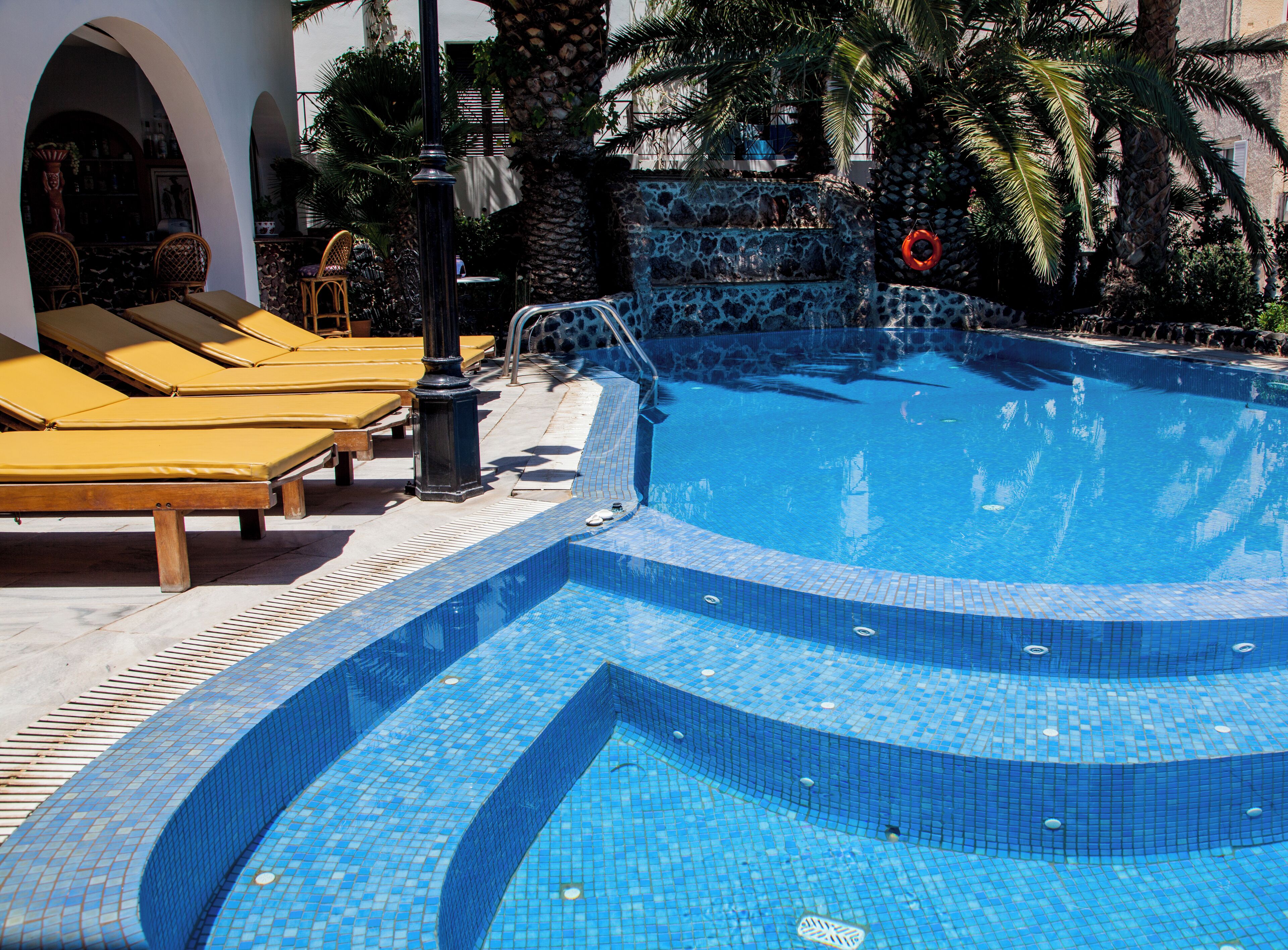 outdoor pool, open 8:00 am to 7:00 pm, pool umbrellas, pool loungers