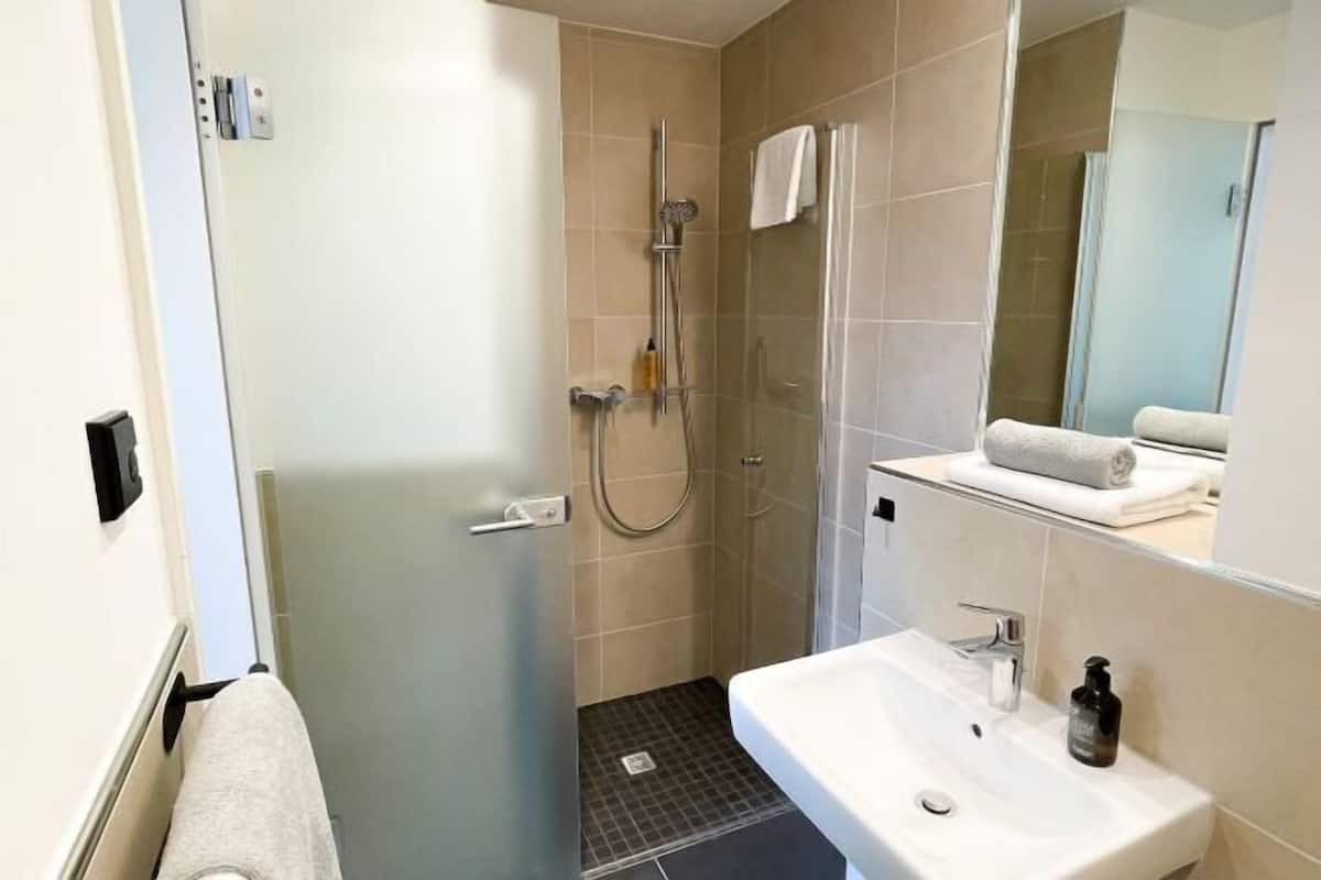Shower, eco-friendly toiletries, hair dryer, towels