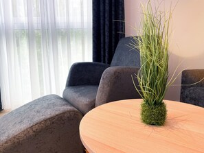 Family Apartment | Living area | 55-inch flat-screen TV with digital channels, tablet - HOLI City Apart Hotel Berlin (Berlin)