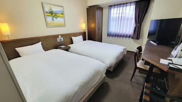 A hotel room with two beds, a desk, a TV, and a painting on the wall.