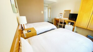 A hotel room with two beds, a desk, a chair, a TV, and a telephone. - Hotel Route-Inn Yokkaichi (Yokkaichi)