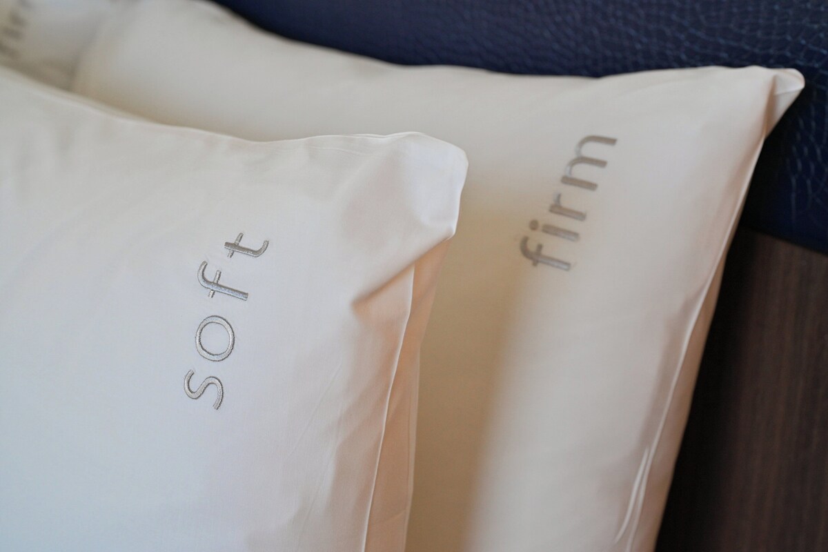 Pillows with embroidered text.
