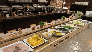 A buffet setup with various food items and utensils. - Hotel Route - Inn Saga Ekimae (Saga)