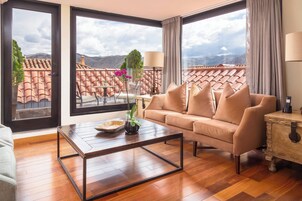 Suite, 1 King Bed, Mountain View | Living area | 49-inch LCD TV with cable channels, TV, iPod dock