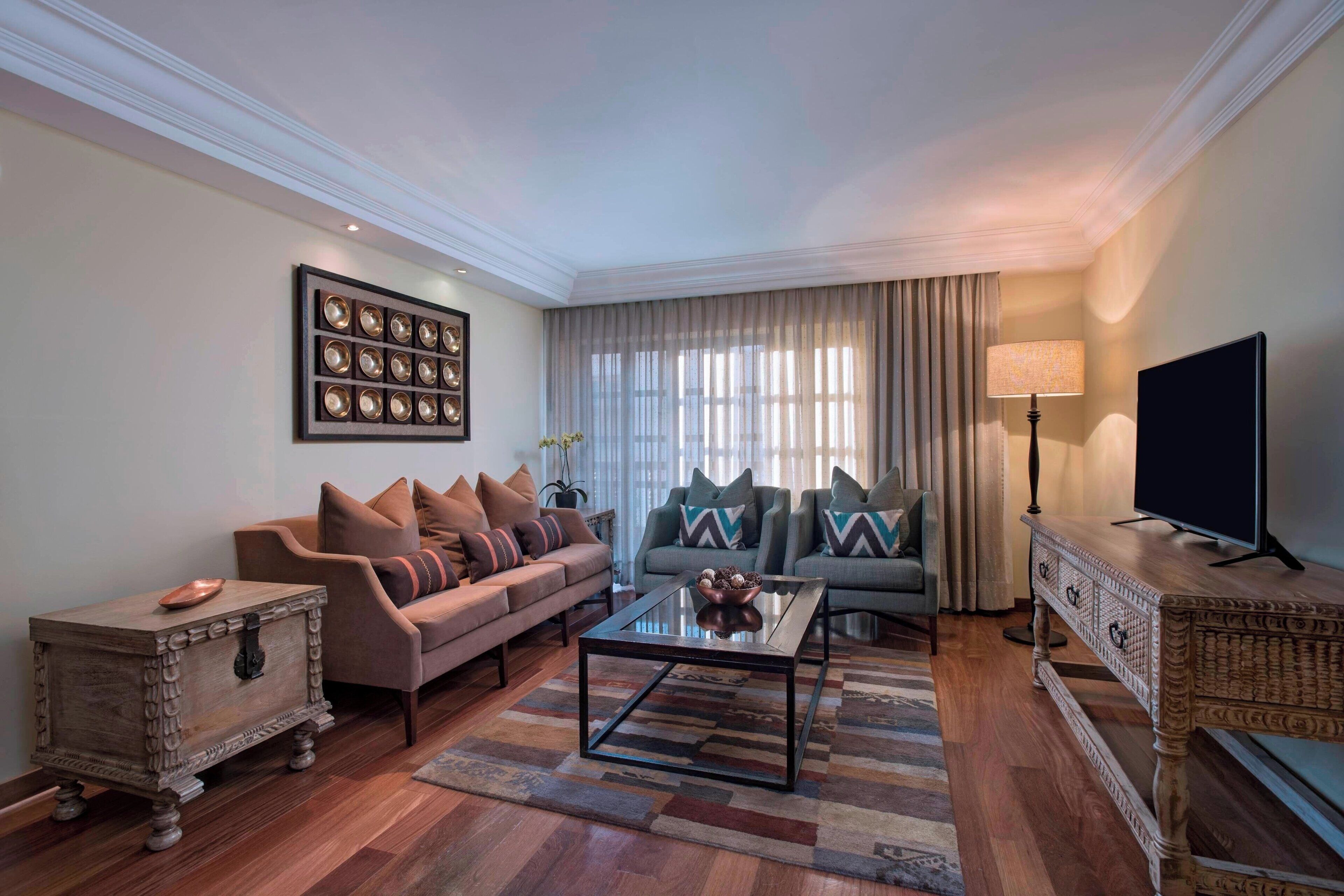 luxury suite, 1 king bed, non smoking | living room | 49-inch lcd tv with cable channels, tv, ipod dock