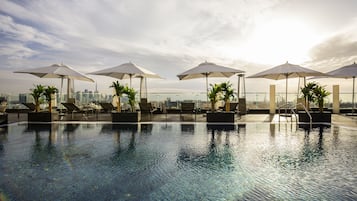 Outdoor pool, pool umbrellas, pool loungers