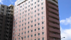 A multi-story hotel with a prominent sign at the top. - Hotel Route-Inn Yamagata Ekimae (Yamagata)