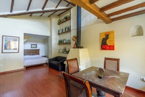 Superior Duplex, Multiple Beds | Living area | 30-inch TV with cable channels, heated floors - Apartaestudios La Candelaria (Bogotá)