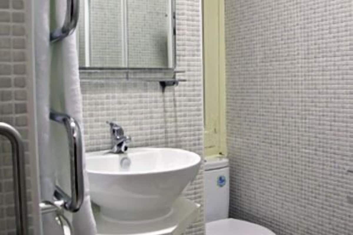 Shower, rainfall showerhead, hair dryer, towels