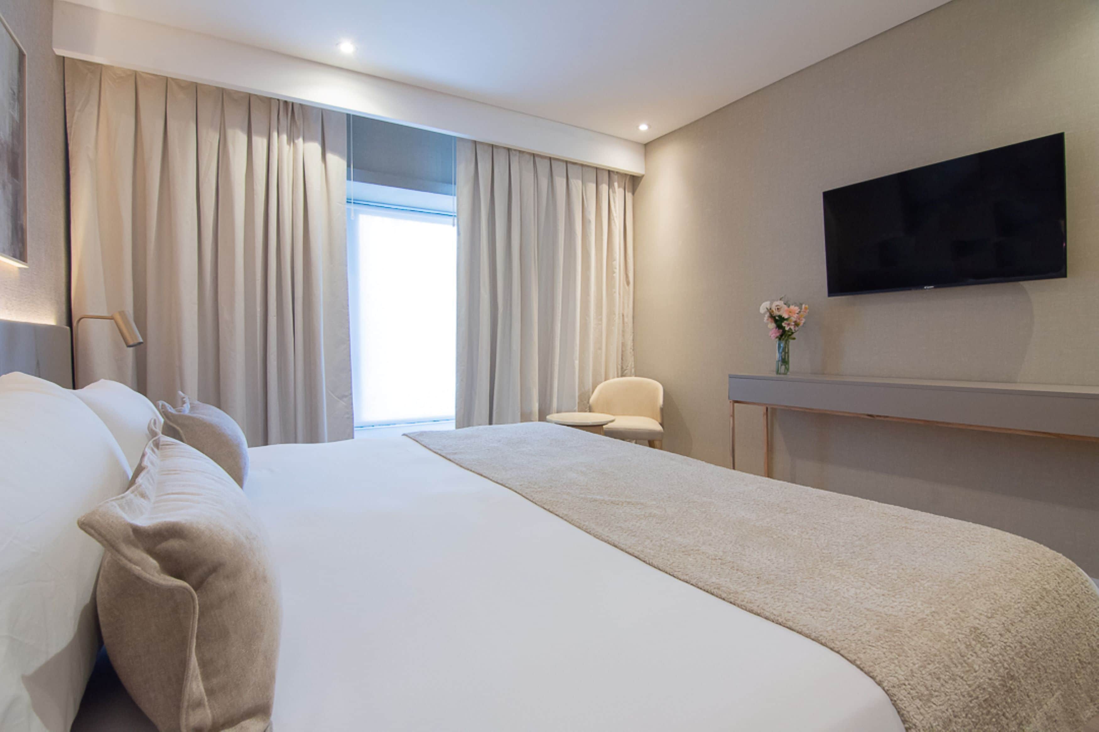 superior double or twin room | minibar, in-room safe, desk, blackout curtains