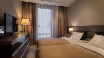 Standard Apartment | Individually decorated, individually furnished, blackout curtains