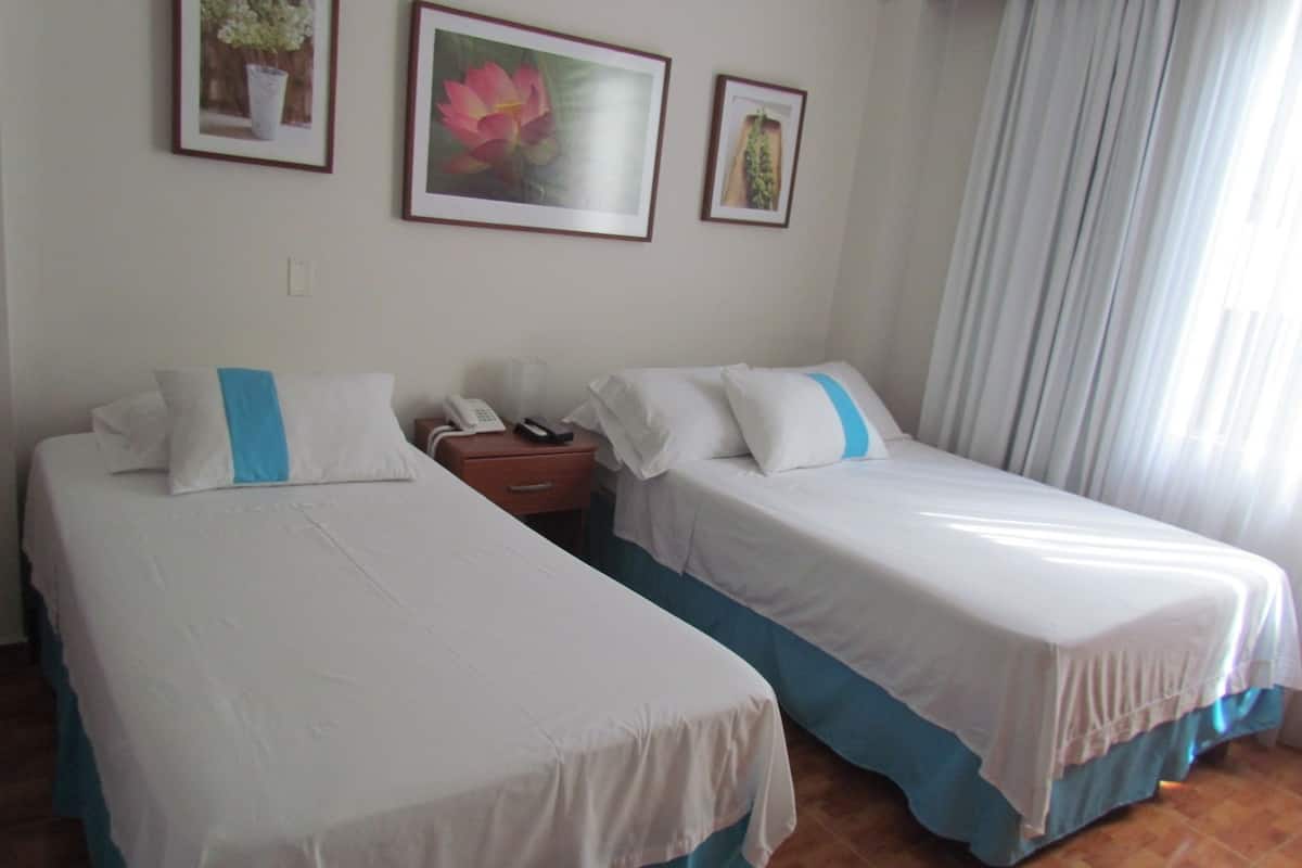 Standard Twin Room, 2 Single Beds, Ensuite | In-room safe, individually decorated, desk, iron/ironing board