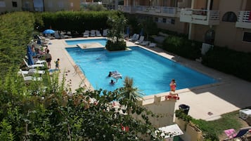 Outdoor pool, open 10:30 AM to 5:00 PM, pool umbrellas, pool loungers