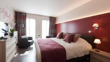 Luxe beddengoed, een minibar, een kluis op de kamer