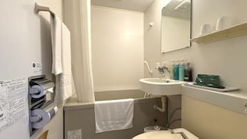 Combined shower/tub, free toiletries, hair dryer, slippers