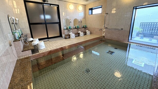 A modern bathroom with a glass-enclosed shower, multiple sinks, and a large mirror. - Hotel Route Inn Niihama (Niihama)