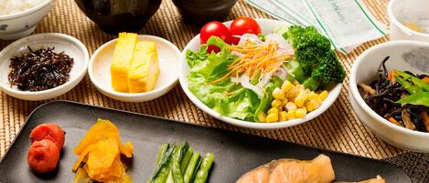 A variety of dishes including salmon, vegetables, and rice, suggesting a meal setting.