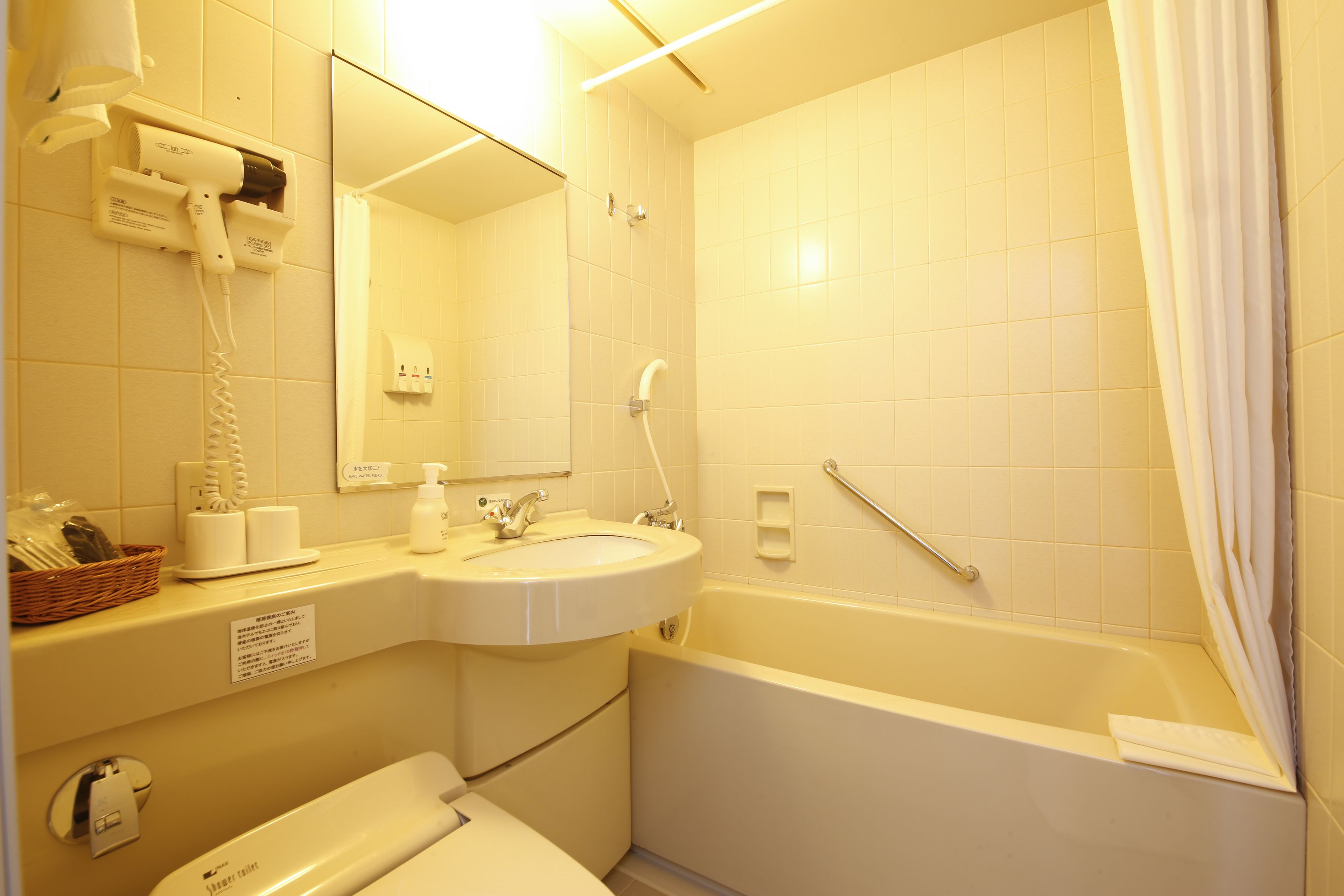 hair dryer, slippers, electronic bidet, towels