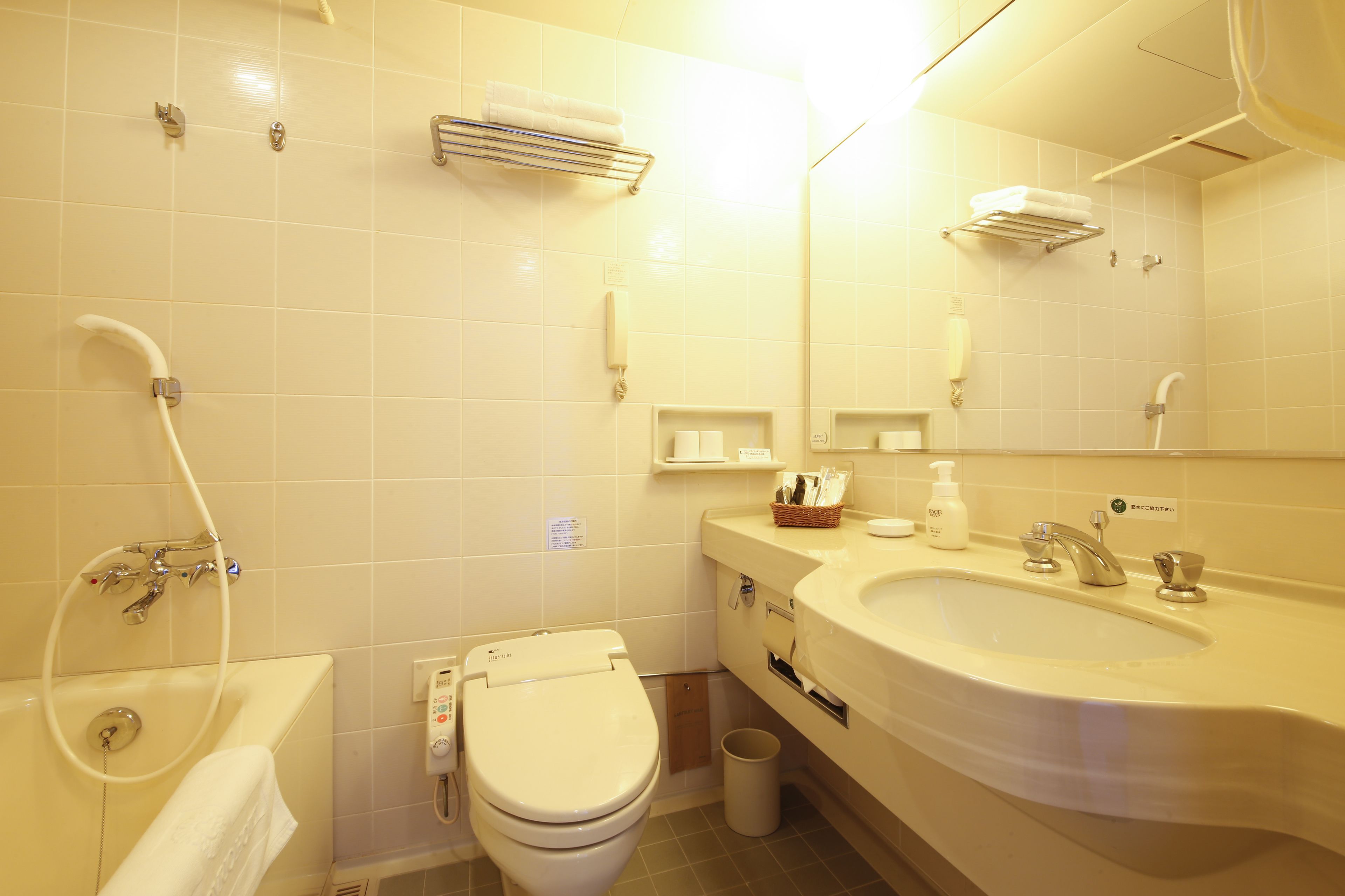 hair dryer, slippers, electronic bidet, towels