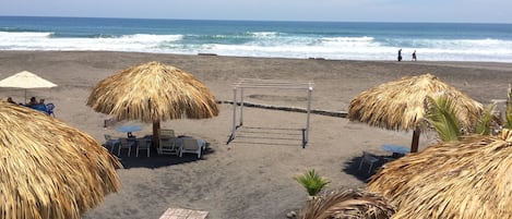 On the beach, surfing