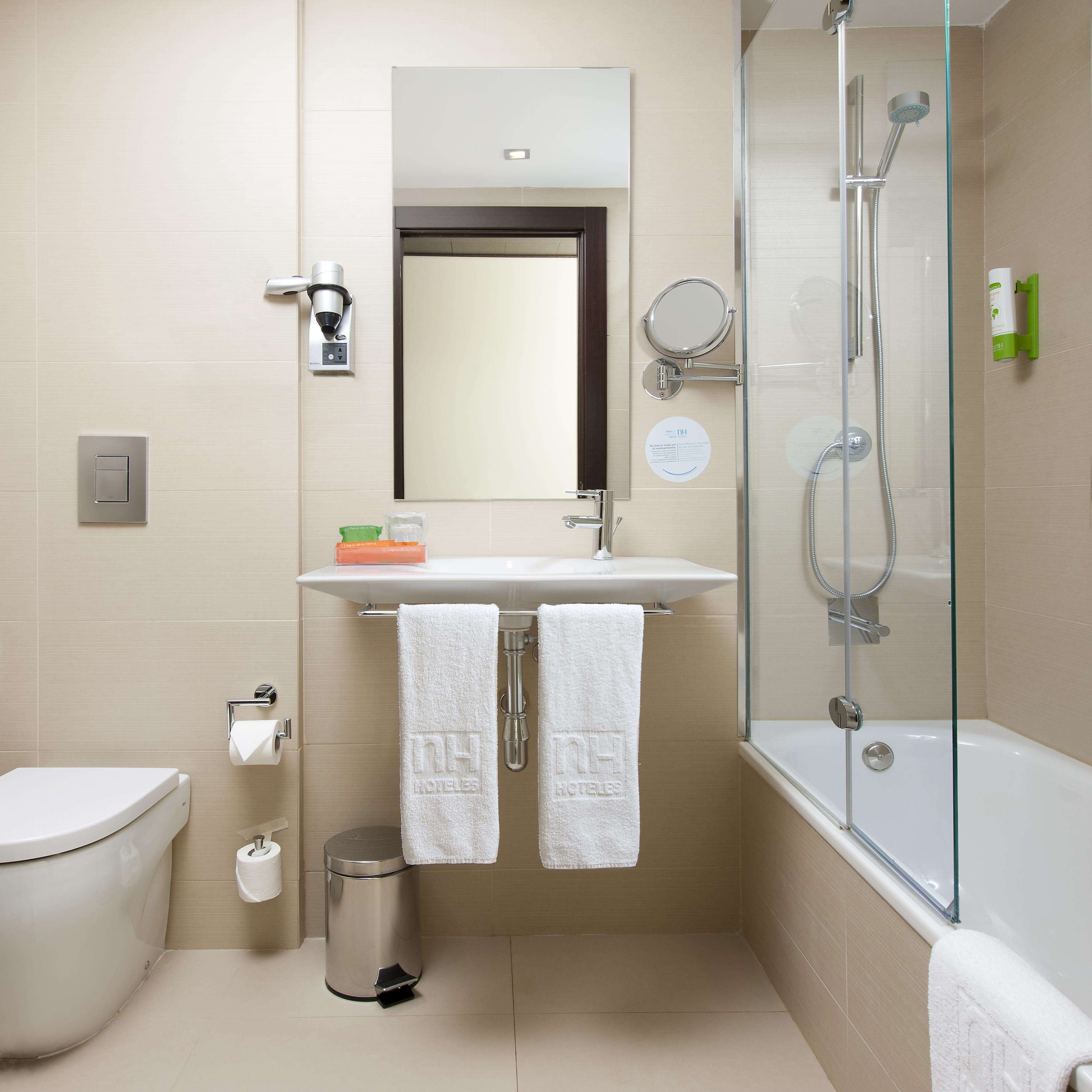 eco-friendly toiletries, hair dryer, towels