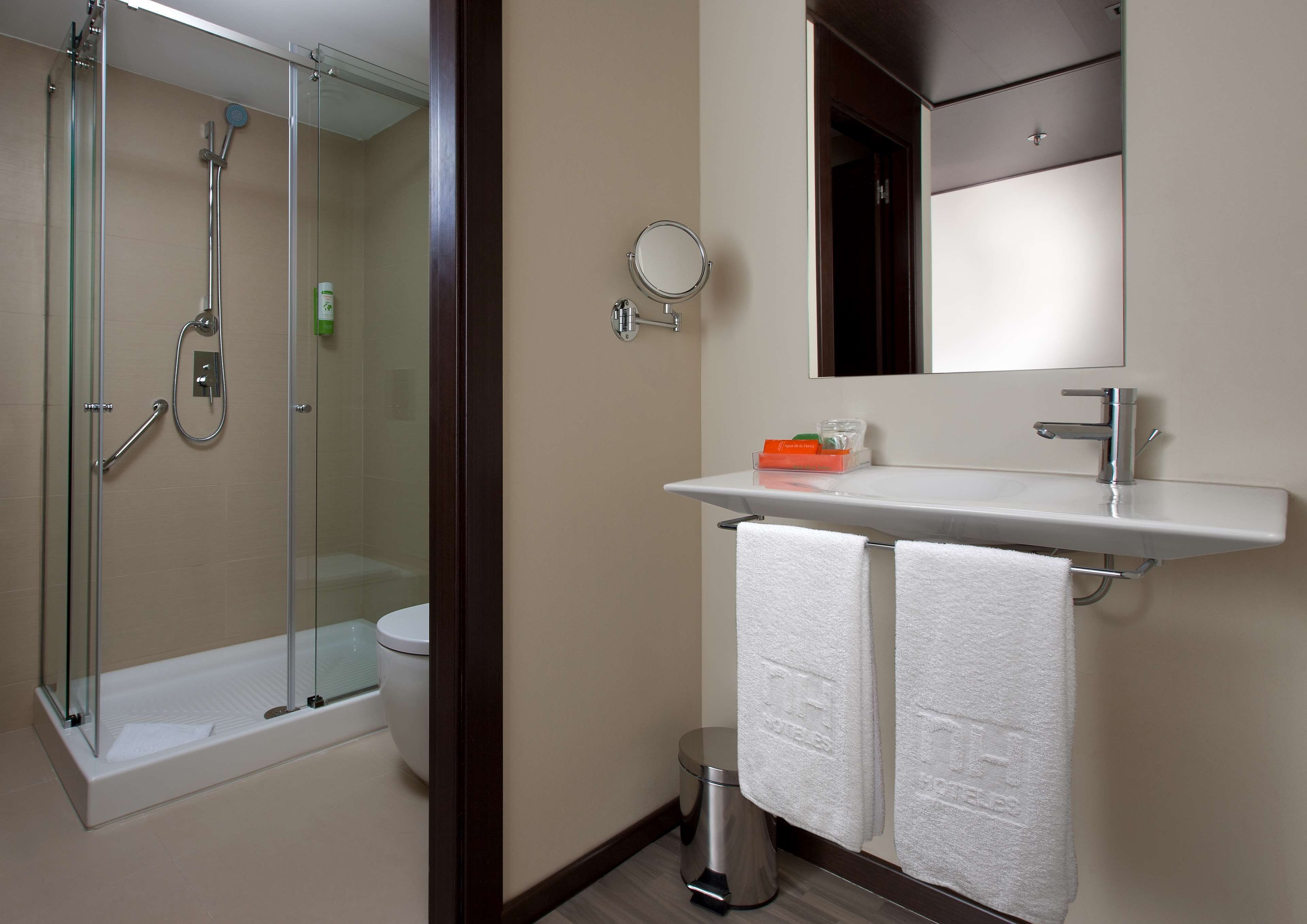 eco-friendly toiletries, hair dryer, towels