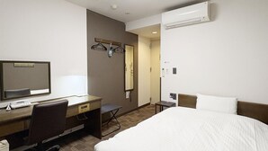 A hotel room with a bed, desk, chair, and a mirror. - Hotel Route-Inn Court Uenohara (Uenohara)