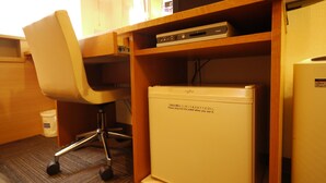 A compact office space with a desk, chair, and a small refrigerator. - Hotel Route - Inn Satsuma Sendai (Satsumasendai)