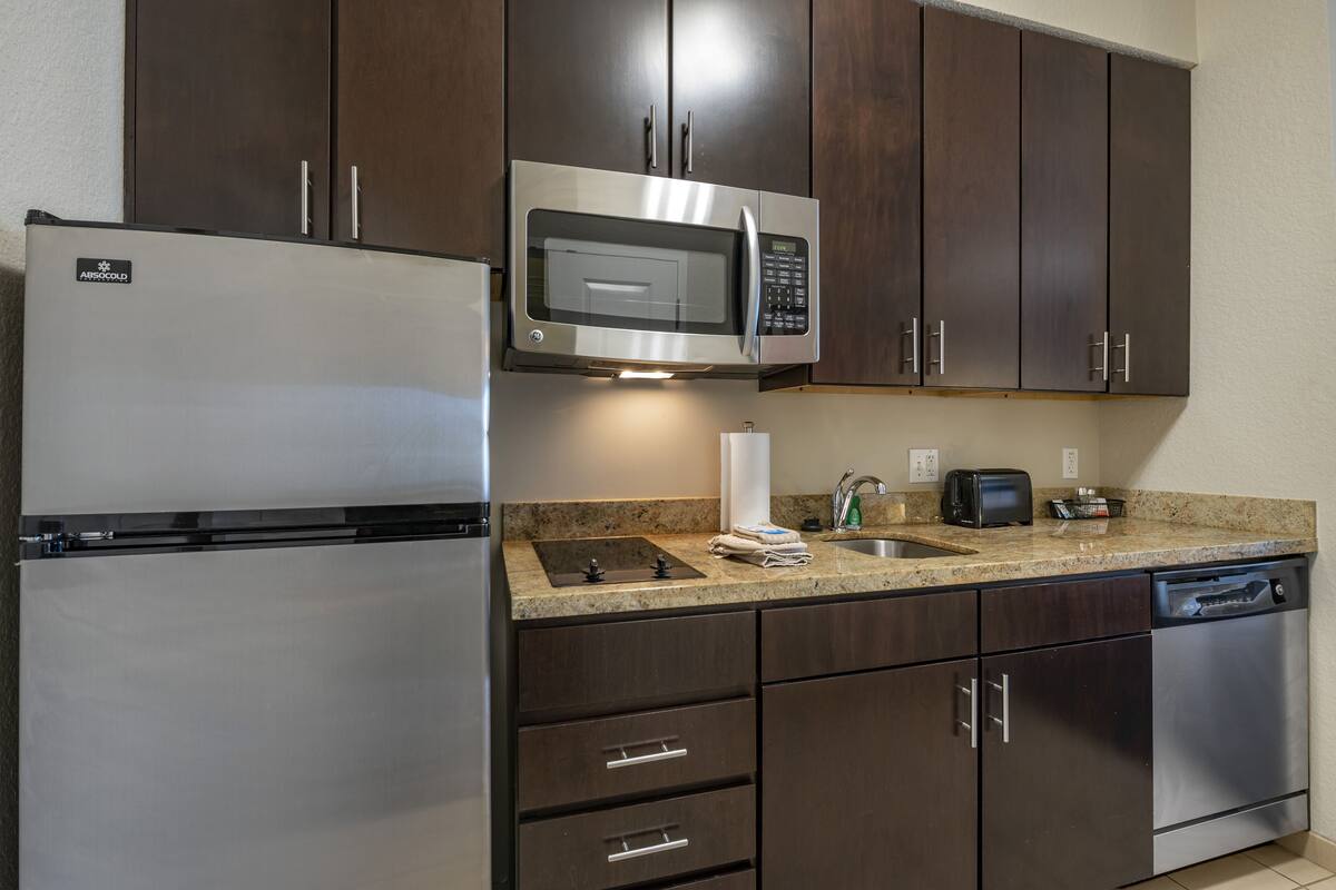 premium bedding, pillow-top beds, laptop workspace, blackout curtains