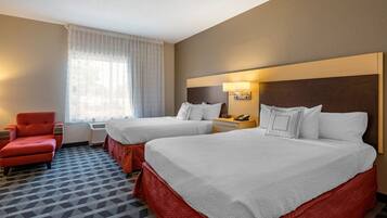 Premium bedding, pillow-top beds, laptop workspace, blackout curtains