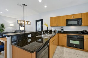 Full-sized fridge, microwave, oven, stovetop - Encantada Resort Vacation Townhomes by IDILIQ (Kissimmee)