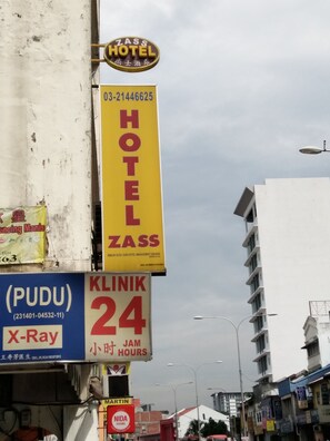 A hotel sign with the name ZASS HOTEL and a contact number. - Zass Hotel (Kuala Lumpur)