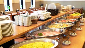A buffet setup with various food items and serving utensils. - Hotel Route-Inn Itoigawa (Itoigawa)